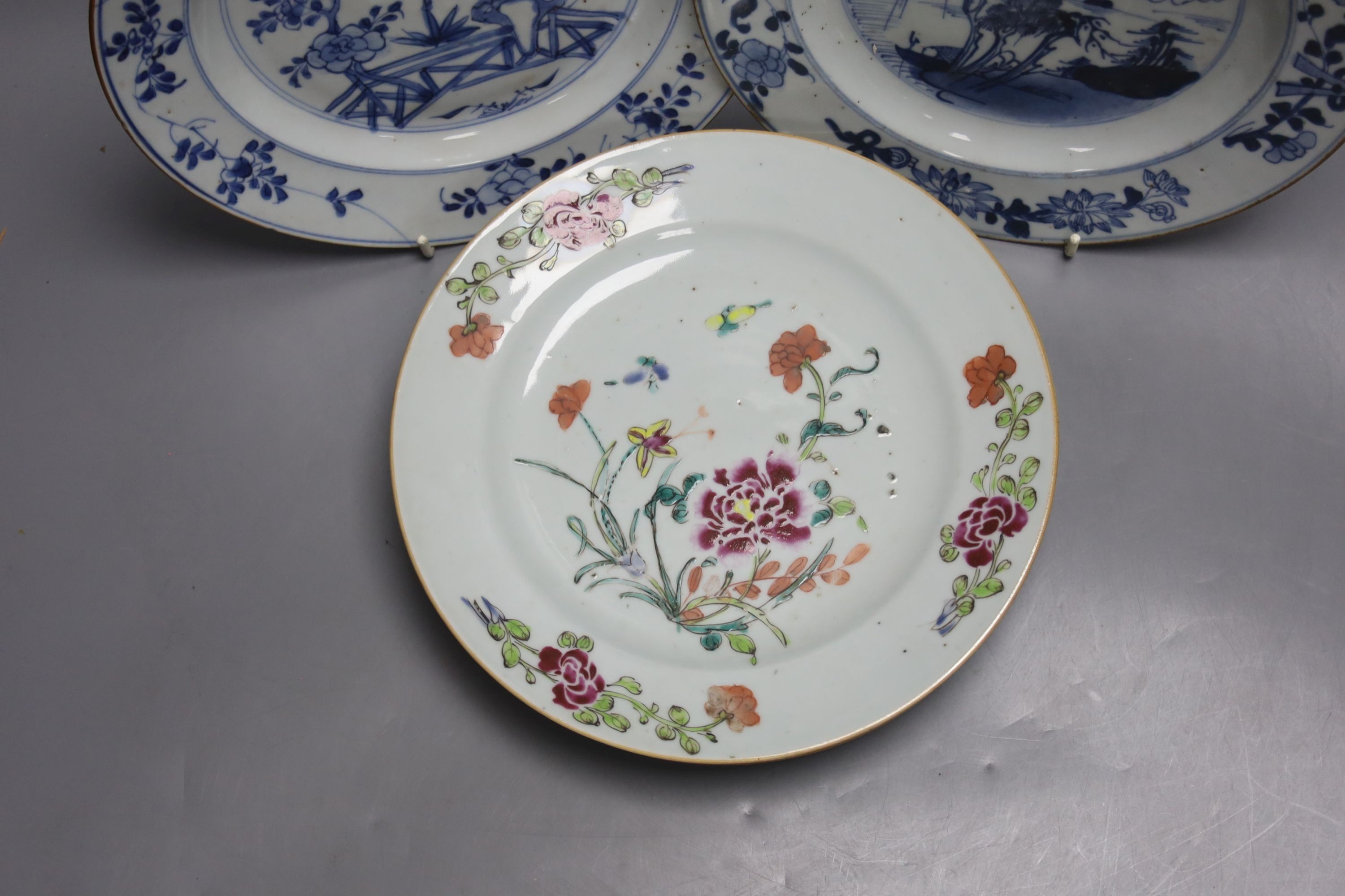 Two 18th century Chinese export blue and white plates, a pair of Chinese Imari patterned plates and four famille rose plates